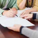Couple signing contract