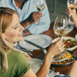 A group of friends from different cultures having a brunch, lunch or diner in an elegant restaurant, representing pure joy, love, wellbeing, friendship, togetherness and other positive emotions, as well as urban city life, a positive mindset and a healthy lifestyle. Witness beautiful people, each from a different cultural backdrop, sharing an elegant lunch in the heart of the city.