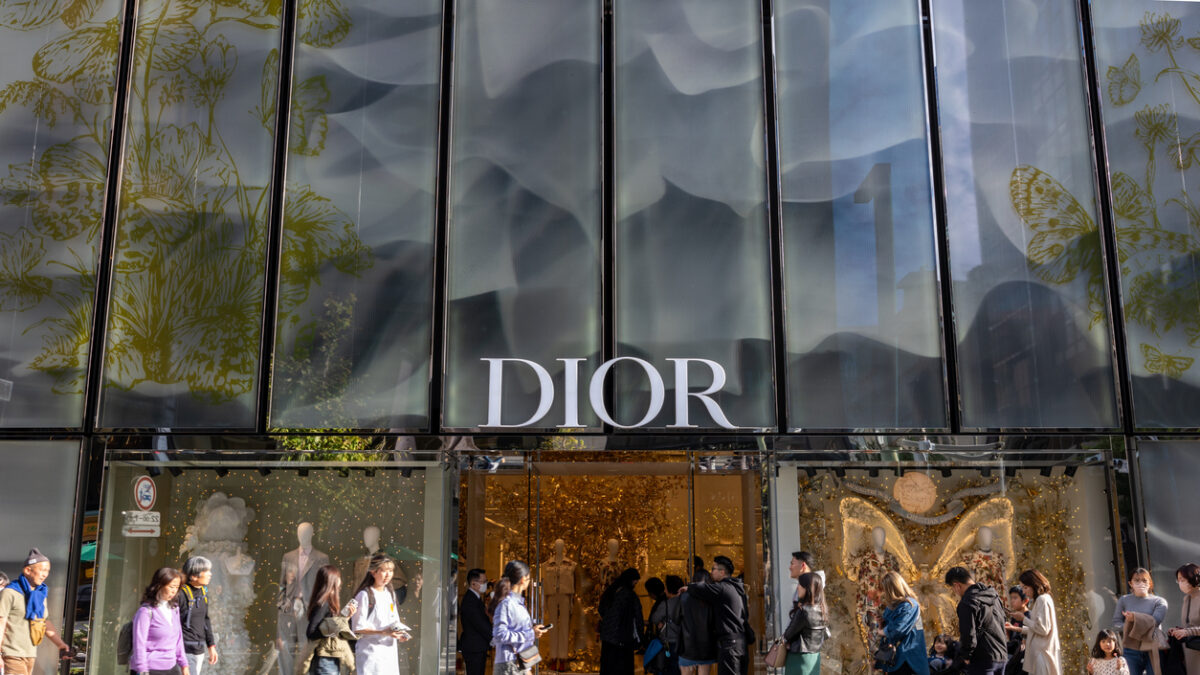 Tokyo, Japan - November 23, 2023 : People queue at the Christian Dior's shop at the Ginza shopping district in Tokyo, Japan.