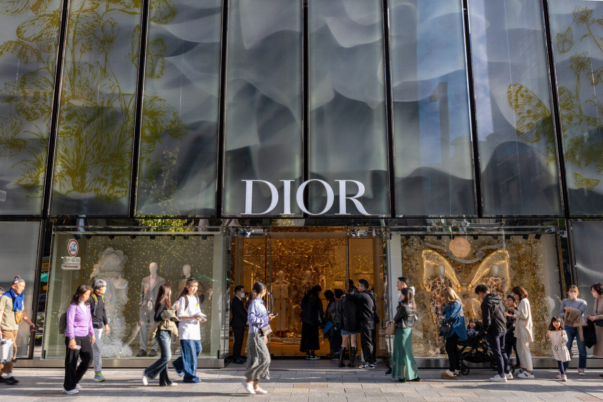 Tokyo, Japan - November 23, 2023 : People queue at the Christian Dior's shop at the Ginza shopping district in Tokyo, Japan.