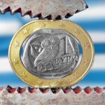Greek euro stressed with a plier symbolizing the financial problems of the country