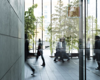 Business person walking in a urban building