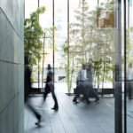 Business person walking in a urban building
