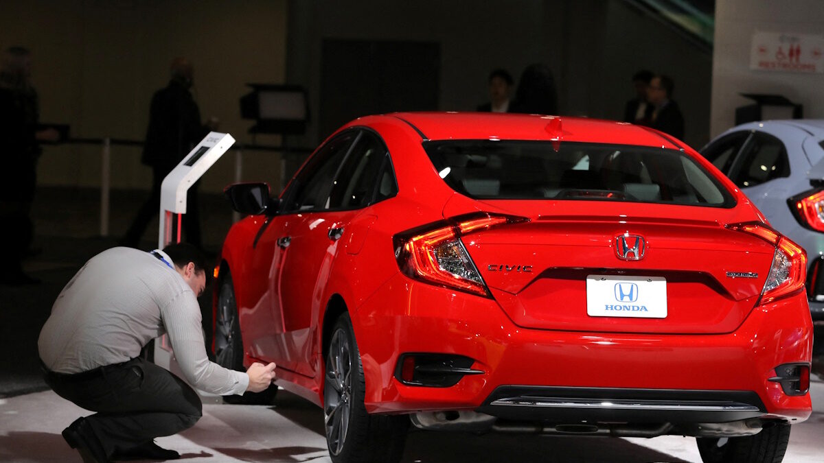Man takes picture of Honda Civic
