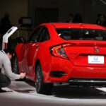 Man takes picture of Honda Civic