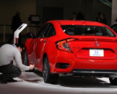 Man takes picture of Honda Civic