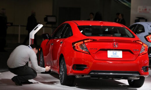 Man takes picture of Honda Civic