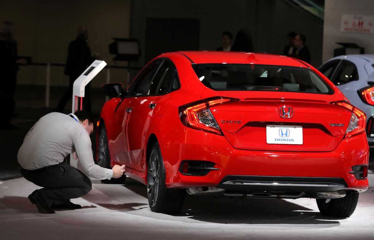 Man takes picture of Honda Civic