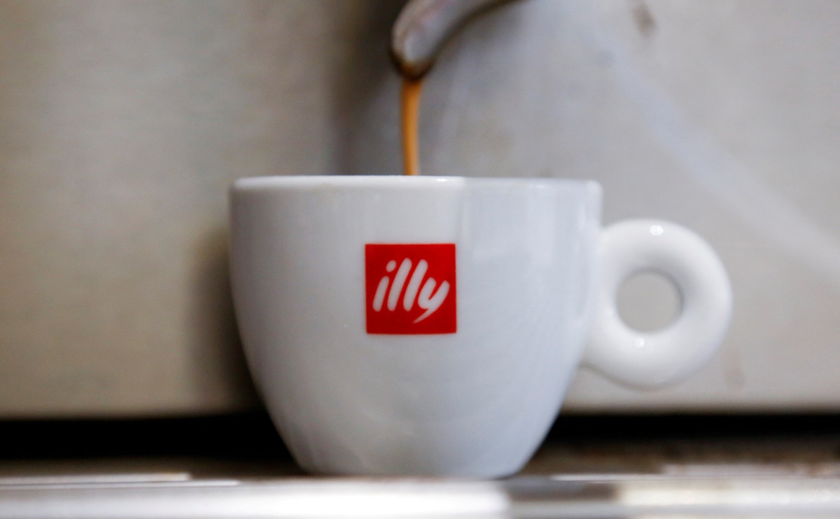 Coffee flows into a Illy cup