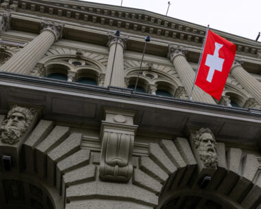 A Swiss flag hangs at the Swiss Parliament building