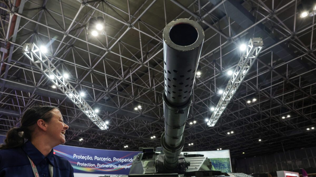 A person reacts next to a tank during LAAD, the biggest military industry expo in Latin America, in Rio de Janeiro, Brazil April 1, 2025. REUTERS