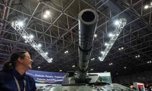 A person reacts next to a tank during LAAD, the biggest military industry expo in Latin America, in Rio de Janeiro, Brazil April 1, 2025. REUTERS