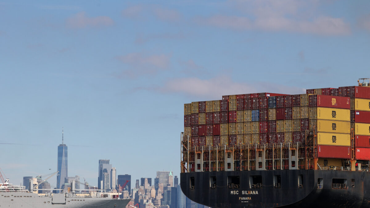 A boat carries shipping containers