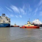 An LNG tanker is guided by tug boats at the Cheniere Sabine Pass LNG export unit in Cameron Parish, Louisiana, U.S., April 14, 2022.