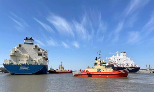 An LNG tanker is guided by tug boats at the Cheniere Sabine Pass LNG export unit in Cameron Parish, Louisiana, U.S., April 14, 2022.