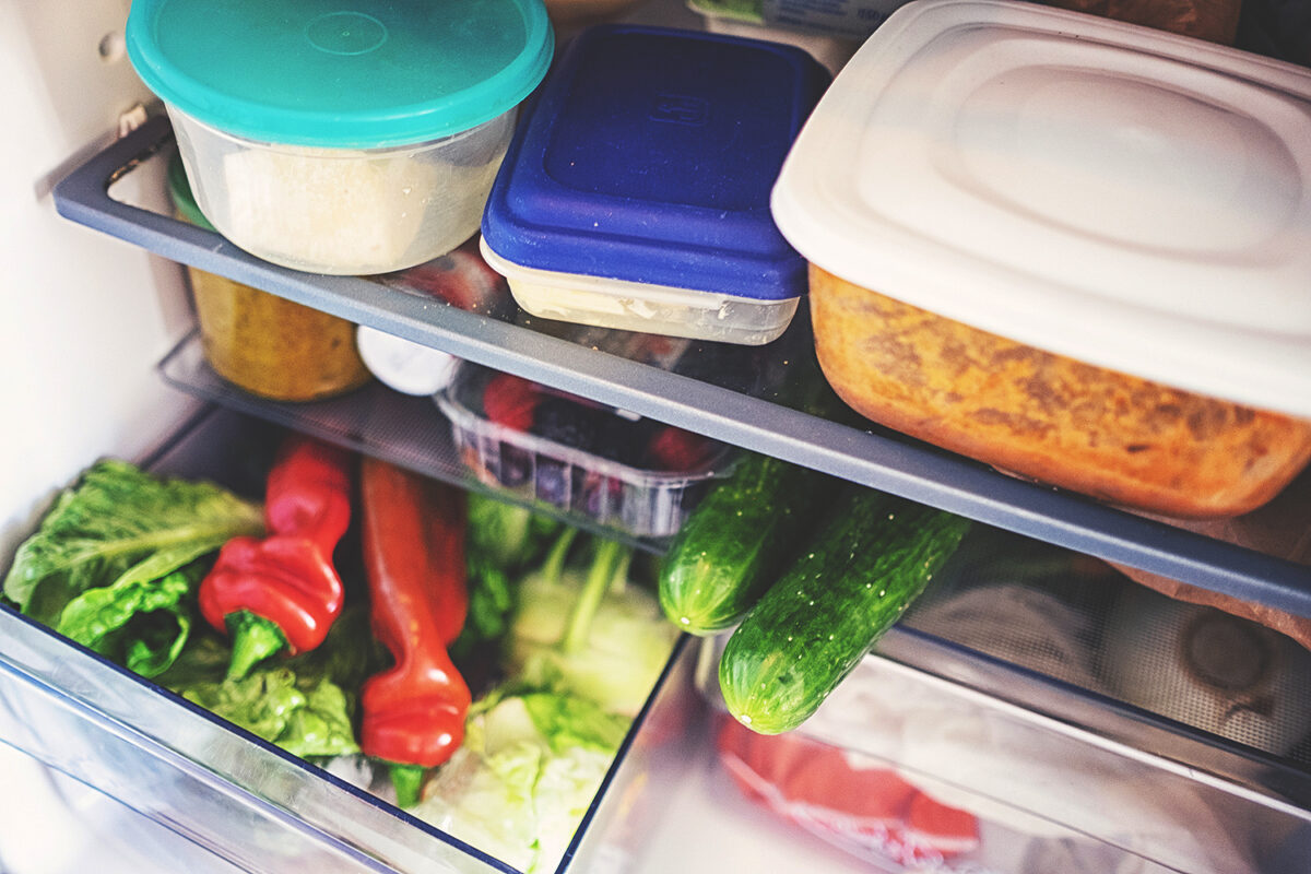 Fresh vegetables for storage in the fridge in a plastic box