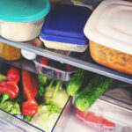 Fresh vegetables for storage in the fridge in a plastic box
