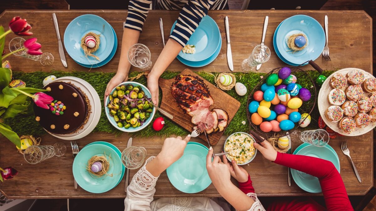 Overhead view on decorated Easter table with family around