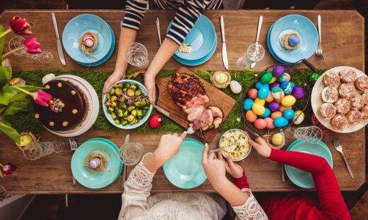 Overhead view on decorated Easter table with family around