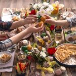 Home Holiday friends or family at the festive Easter table with Easter colored eggs. The concept of the celebration