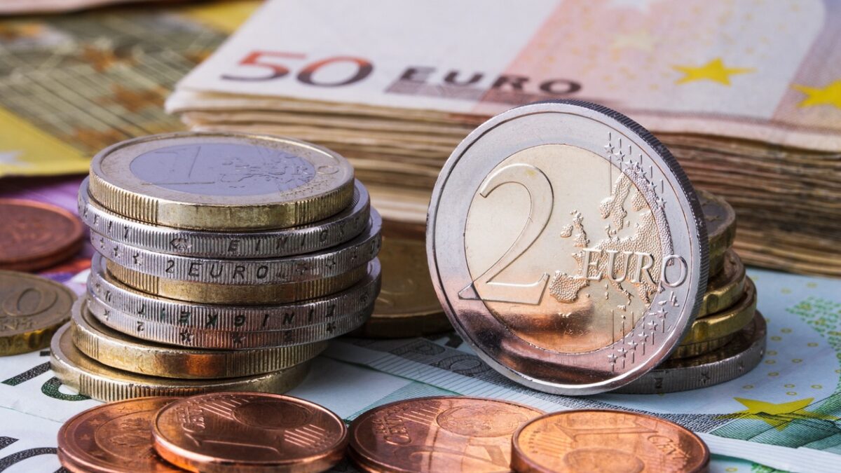 Banknotes and euro coins of different denominations
