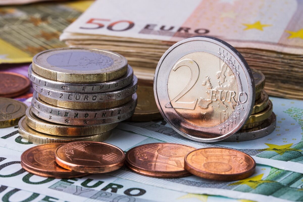 Banknotes and euro coins of different denominations
