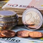 Banknotes and euro coins of different denominations