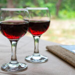 Red greek wine is glass from Nemea region, wine tasting, close up