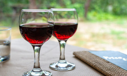 Red greek wine is glass from Nemea region, wine tasting, close up