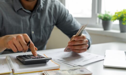 Man using calculator
