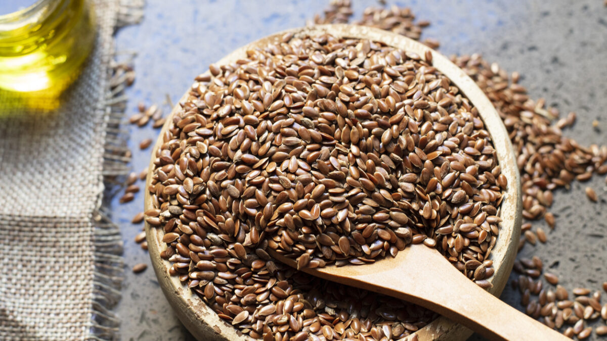 Flax seeds in a wooden bowl.