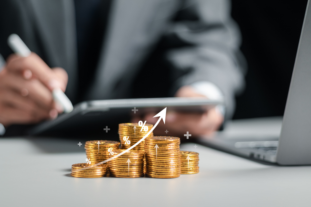 Businessman collecting coins with profit chart analysis business growth, profit growth management and corporate financial statistics