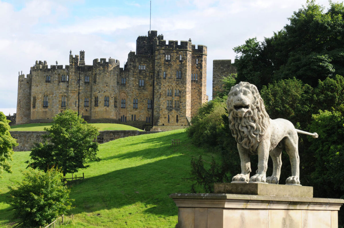 The lion sits on the bridge over the River Aln, overlooked Alnwick Castle. There has been a castle on this site since 1096