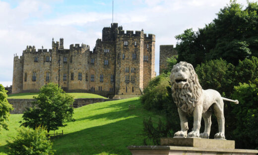 The lion sits on the bridge over the River Aln, overlooked Alnwick Castle. There has been a castle on this site since 1096
