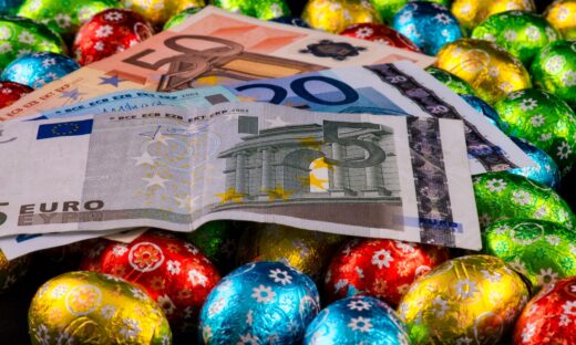 Close up of money and colorful chocolate eggs