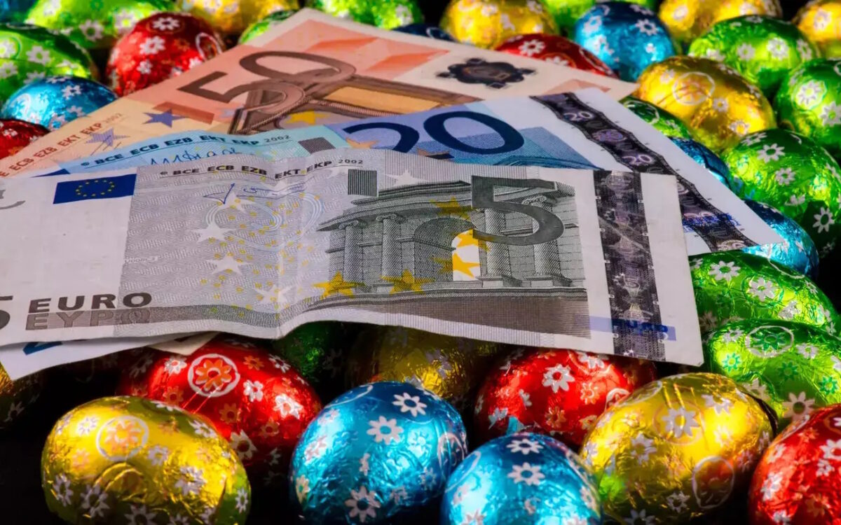 Close up of money and colorful chocolate eggs
