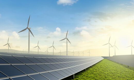 Solar farm and wind turbine on green fields