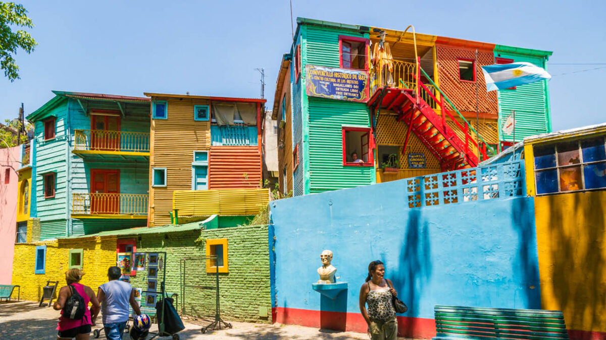"Buenos Aires, Argentina - January 30, 2013:Tourist enjoying a walk along El Caminito, one of the most famous streets in the quarter La Boca. This part of La Boca is famous for its colorful houses and visited by many tourists and it is a major attraction in the city Buenos Aires."