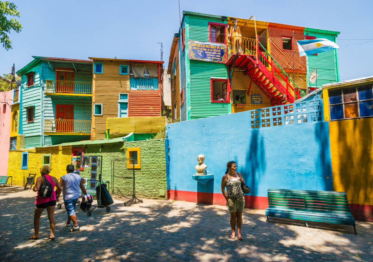 "Buenos Aires, Argentina - January 30, 2013:Tourist enjoying a walk along El Caminito, one of the most famous streets in the quarter La Boca. This part of La Boca is famous for its colorful houses and visited by many tourists and it is a major attraction in the city Buenos Aires."