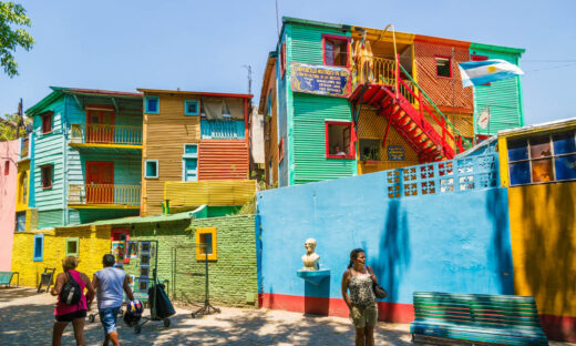 "Buenos Aires, Argentina - January 30, 2013:Tourist enjoying a walk along El Caminito, one of the most famous streets in the quarter La Boca. This part of La Boca is famous for its colorful houses and visited by many tourists and it is a major attraction in the city Buenos Aires."
