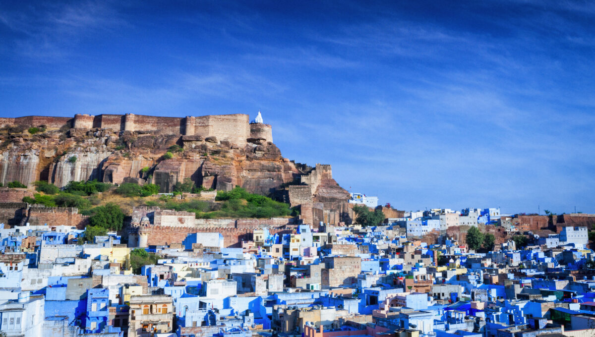 High angle cityscape of the Blue City and Mehrangarh Fort, Jodhpur, India.
