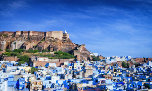 High angle cityscape of the Blue City and Mehrangarh Fort, Jodhpur, India.