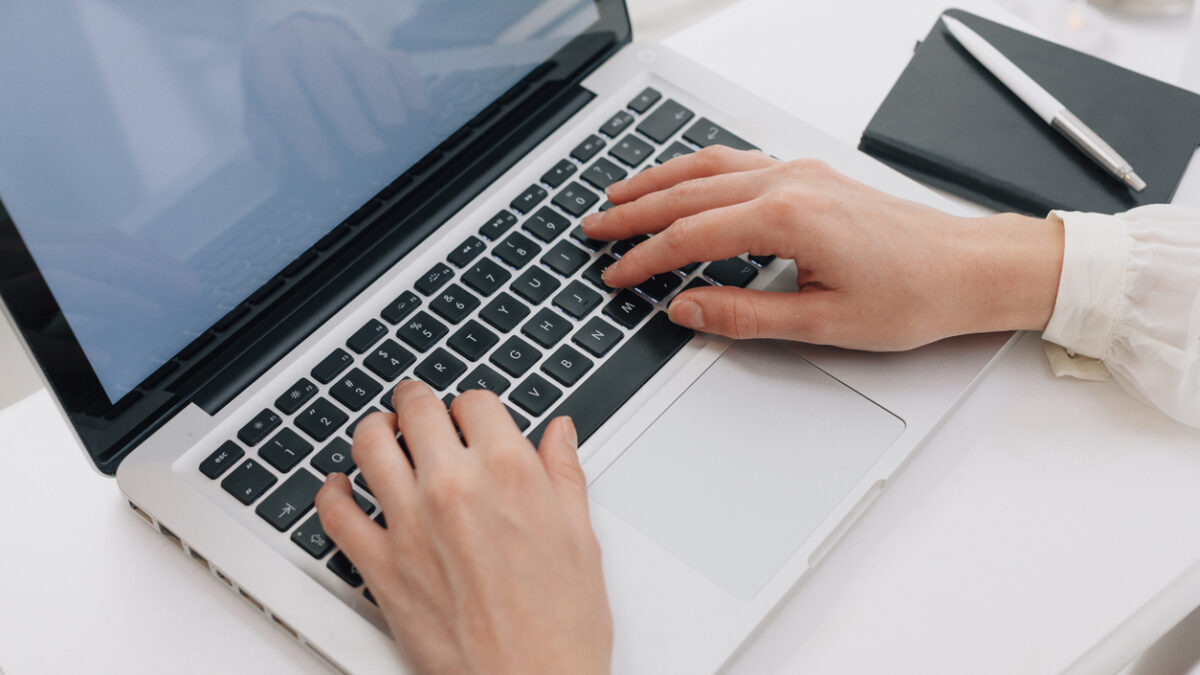 Close Up Of Woman Using Laptop