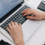 Close Up Of Woman Using Laptop