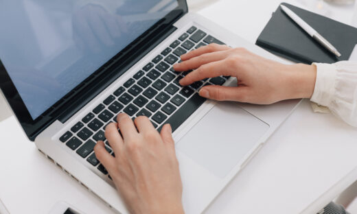 Close Up Of Woman Using Laptop