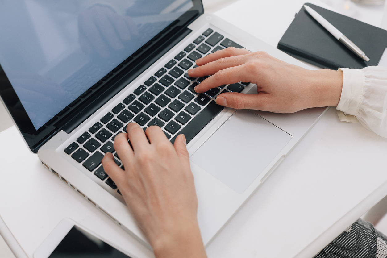 Close Up Of Woman Using Laptop