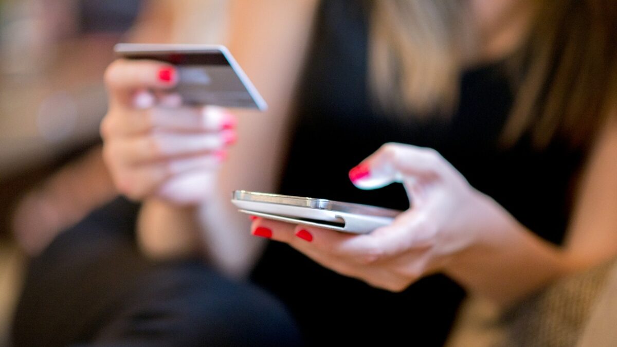 Mobile Payment, Close up hands holding credit card and using mobile smart phone