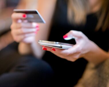 Mobile Payment, Close up hands holding credit card and using mobile smart phone