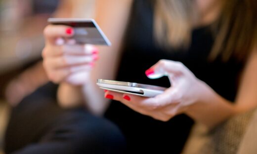 Mobile Payment, Close up hands holding credit card and using mobile smart phone