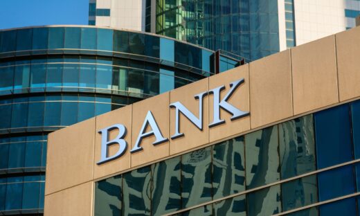 Bank sign on glass wall of business center